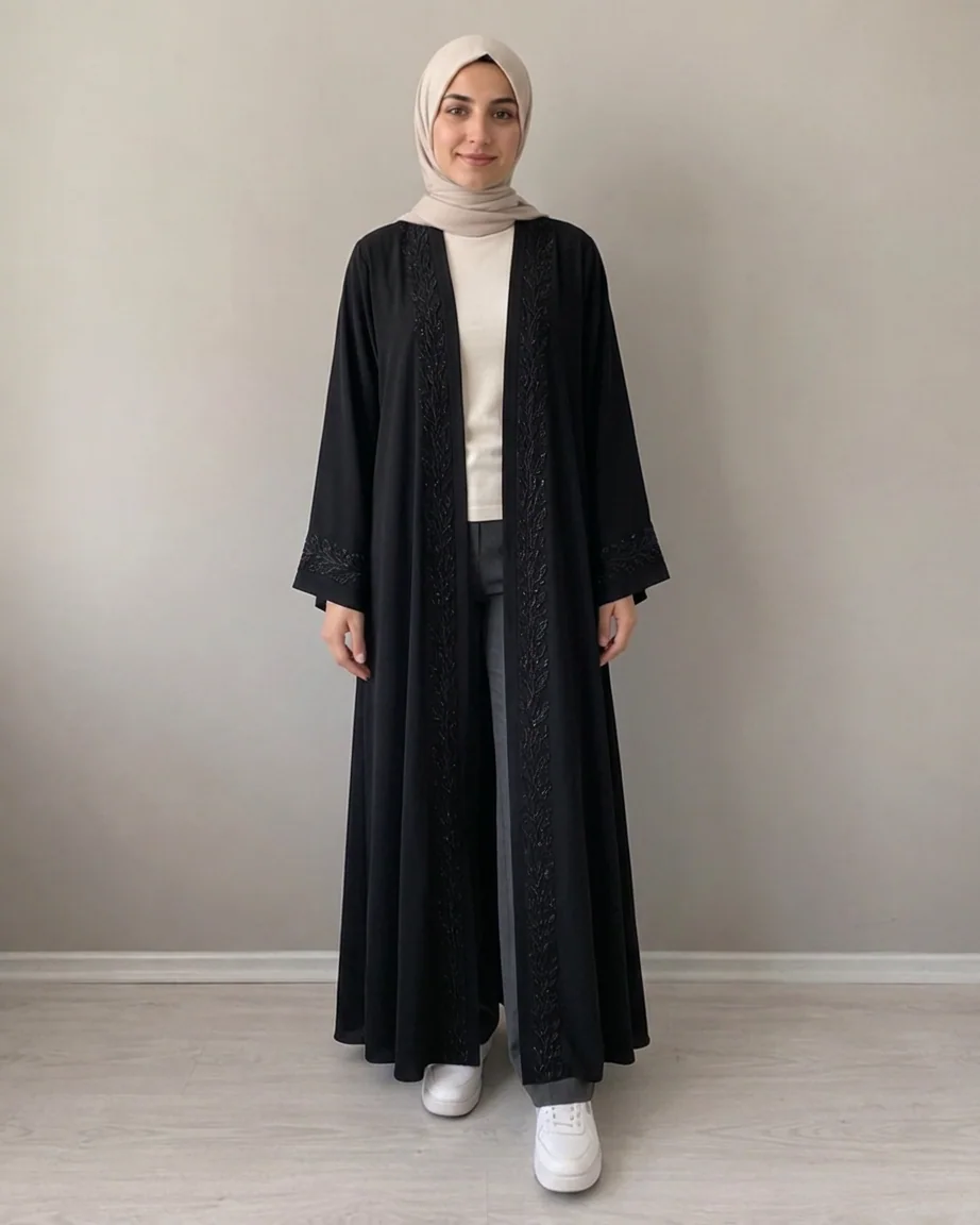 Try-on image: embroidered abaya on the first shopper.